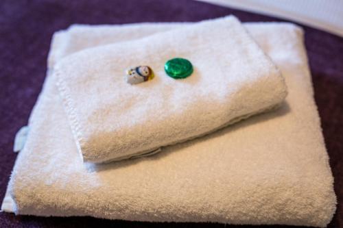 two earrings sitting on top of a napkin at Portland House in Keswick