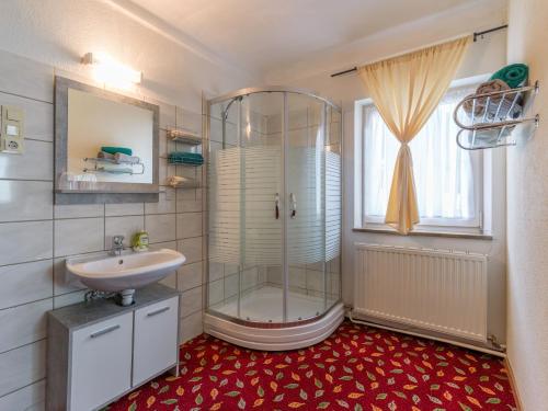 a bathroom with a shower and a sink at Landgasthof Oberlander in Kirchbichl