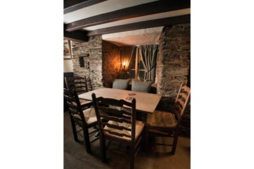 a dining room with a table and chairs at The Dolphin Inn in Kingsbridge