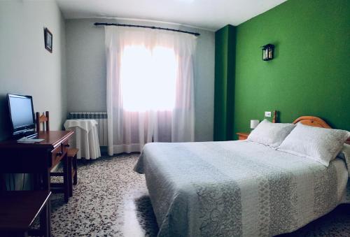Ένα ή περισσότερα κρεβάτια σε δωμάτιο στο Hotel Rural Familiar Almirez-Alpujarra