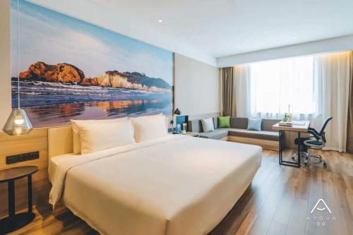 Ένα ή περισσότερα κρεβάτια σε δωμάτιο στο Atour Hotel Shenzhen Longgang Buji Lilang