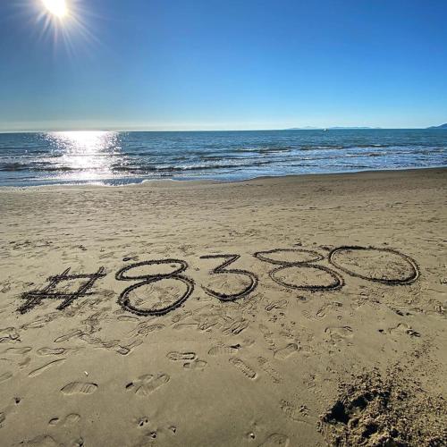 a new year is written in the sand on the beach at MaremMare Tuscany Apartments in Principina a Mare
