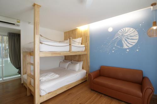 Postel nebo postele na pokoji v ubytování Tawaen Beach Resort