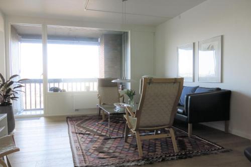 a living room with a couch and a table at ApartmentInCopenhagen Apartment 1442 in Copenhagen