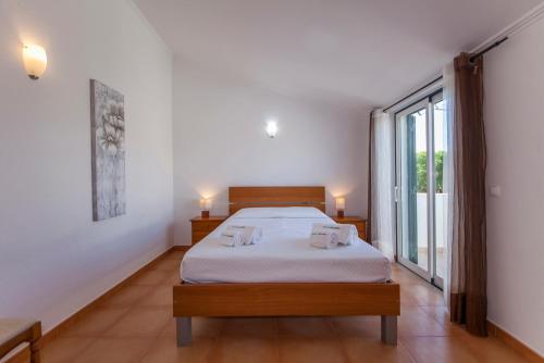 Llit o llits en una habitació de A14 - Cozy Torraltinha Apartment