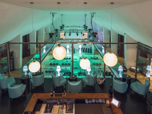 an overhead view of a restaurant with chairs and a bar at Rome Life Hotel in Rome