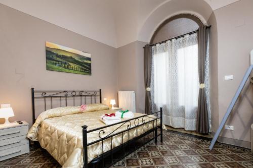 En eller flere senge i et værelse på Appartamento Eden Tuscany