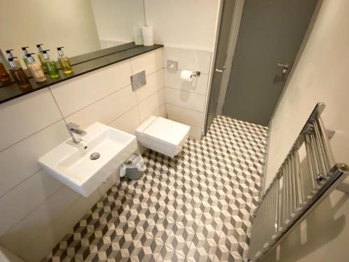 A bathroom at Loft at The Coach House Apartments