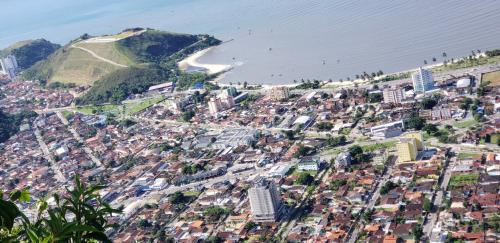 an aerial view of a city and the ocean at POUSADA VERDE in Caraguatatuba