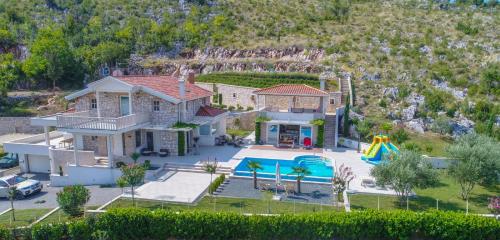 an aerial view of a house with a pool at Villa VAND Paradiso in Međugorje
