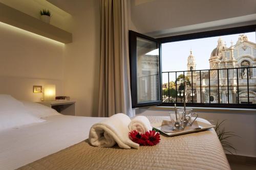 Ένα ή περισσότερα κρεβάτια σε δωμάτιο στο Le Suites Del Duomo
