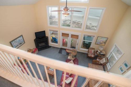 an overhead view of a living room with a staircase at BEACH FRONT!!! Steps from the Beach - Fantastic Views in Harbor Island