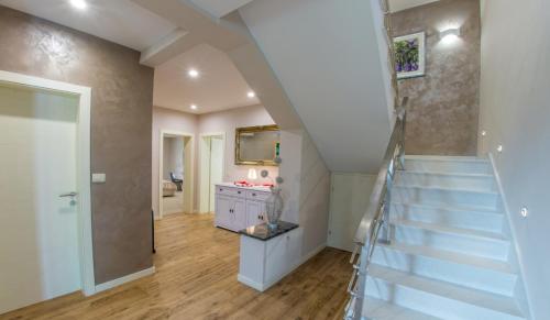 a staircase in a home with a stair case at Villa VAND Paradiso in Međugorje