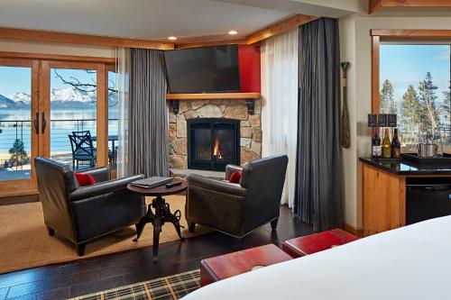 a hotel room with a fireplace and a television at The Landing Resort and Spa in South Lake Tahoe