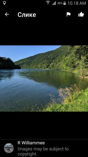 a picture of a river with a picture of a mountain at Prenoćište na Drini Foča in Foča