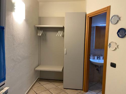 a small bathroom with a sink and a shower at B&B ALDA in Levanto