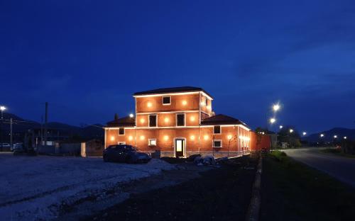 a house with a car parked in front of it at night at Taverna Ferrigno in Padula