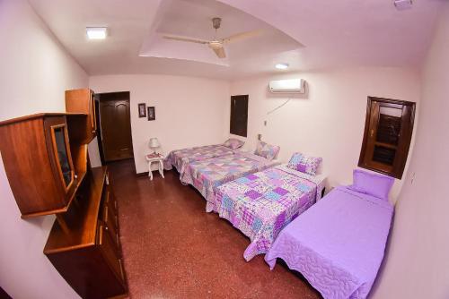 an overhead view of a bedroom with two beds at Palmera Hotel CDE in Ciudad del Este