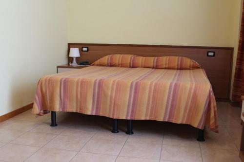 Postel nebo postele na pokoji v ubytování HOTEL LE MORGE