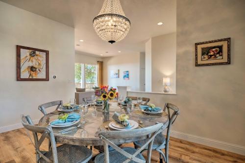 a dining room with a table with chairs and a chandelier at Hot Tub and Mtn Views Peaceful Columbia Retreat! in Columbia