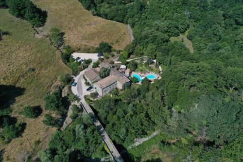 an aerial view of a house on a mountain at Ferme du Pic d'Allier in Saint Martin sur Lavezon