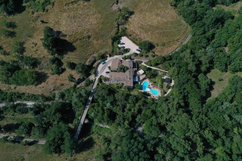 an aerial view of a house on a hill at Ferme du Pic d'Allier in Saint Martin sur Lavezon