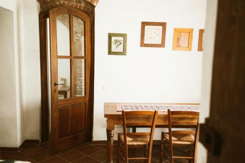 a dining room with a table and two chairs at Agriturismo La Torretta in Siena