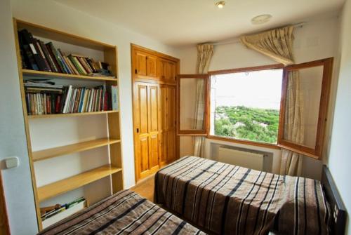 A bed or beds in a room at Club Villamar - Sport