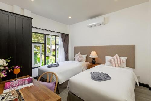 Tempat tidur dalam kamar di Patong Garden House - Luxury Villa in Patong Hills