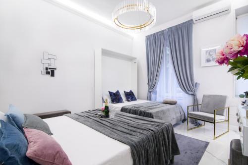 Krevet ili kreveti u jedinici u objektu Roma Deluxe Apartments