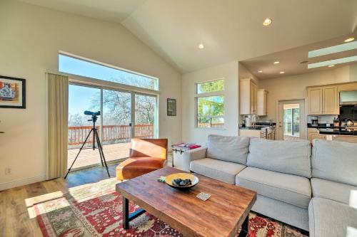 a living room with a couch and a table at Hot Tub and Mtn Views Peaceful Columbia Retreat! in Columbia