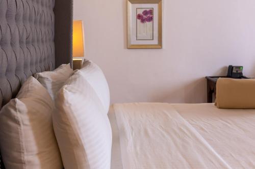 Postel nebo postele na pokoji v ubytování Hotel Hacienda San Cristóbal