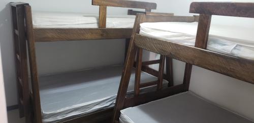 two brown bunk beds in a room at Ciudadela Santafe in Santa Fe de Antioquia