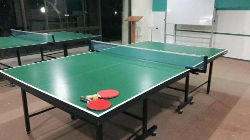 two ping pong tables with ping pong balls on them at VIP CONDO RAYONG 343 in Rayong