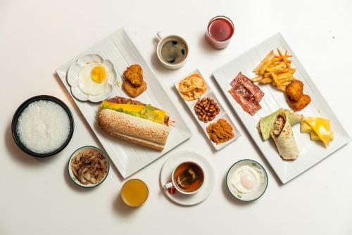 a table with three plates of food with eggs and dips at Fish Hotel Taitung in Taitung City