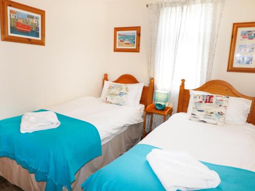 Ένα ή περισσότερα κρεβάτια σε δωμάτιο στο Dartmoor Valley Lodge