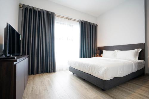 TV a/nebo společenská místnost v ubytování The First Stay Hotel