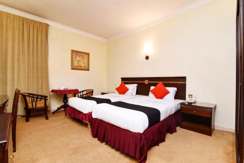 Voodi või voodid majutusasutuse Capital O 419 Al Safeer Hotel toas