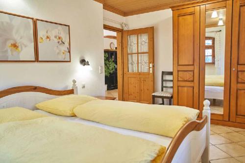 a bedroom with two beds in a room at Ferienpension Posthof in Waldmünchen
