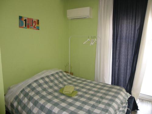 Posteľ alebo postele v izbe v ubytovaní Mini suite neighboring the center