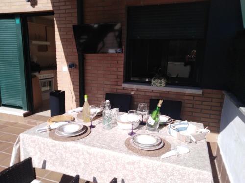 a table with plates and wine bottles on it at DavidSara in Llanes