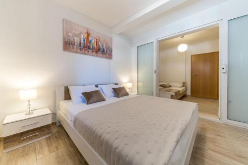 Posteľ alebo postele v izbe v ubytovaní Apartment Visic's place