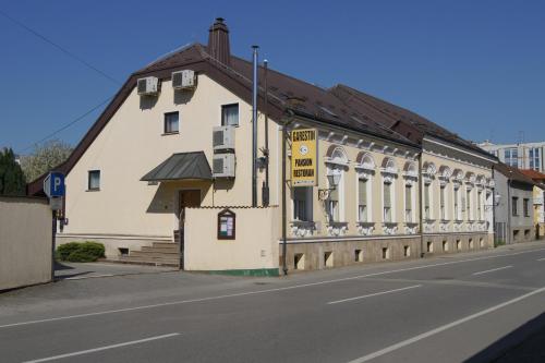 
a building with a sign on the side of it at B&B Garestin in Varaždin
