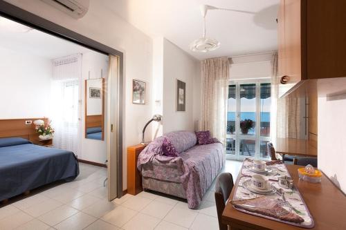 Ένα ή περισσότερα κρεβάτια σε δωμάτιο στο Casavacanze Internazionale