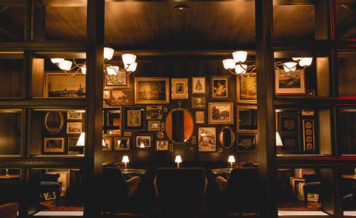 a restaurant with a wall of pictures on the wall at Park MGM Las Vegas in Las Vegas