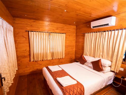 Postel nebo postele na pokoji v ubytování Tycoon Resort