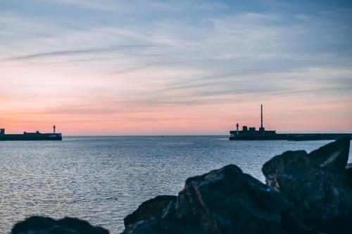 a view of the ocean with two ships in the water at Best Western ARThotel in Le Havre