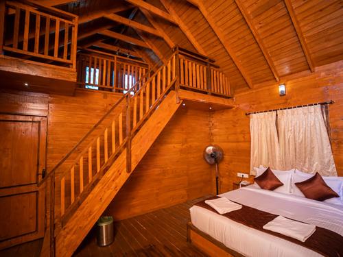 Postel nebo postele na pokoji v ubytování Tycoon Resort