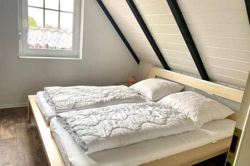 Postel nebo postele na pokoji v ubytování Ferienwohnung Nr. 3 - Leuchttürmchen