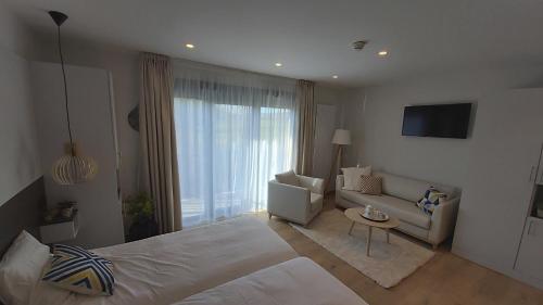 Katil atau katil-katil dalam bilik di Villa Thermae Santenay